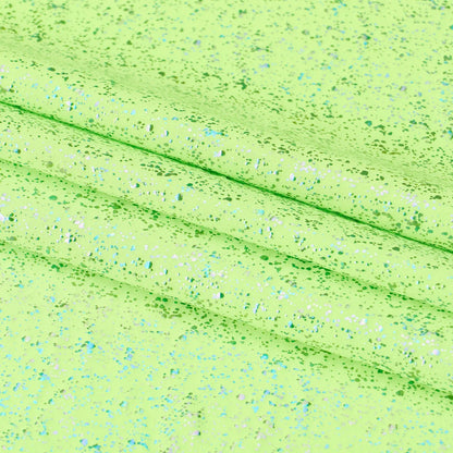 Close-up of a textured green fabric with speckles