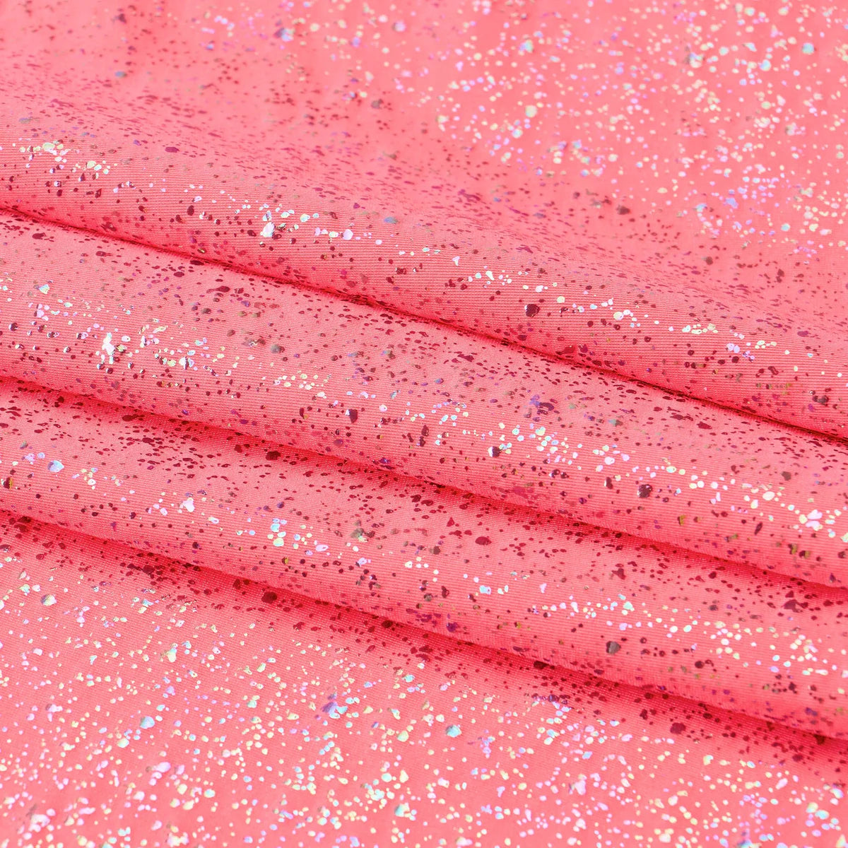 Close-up of coral fabric with glitter texture