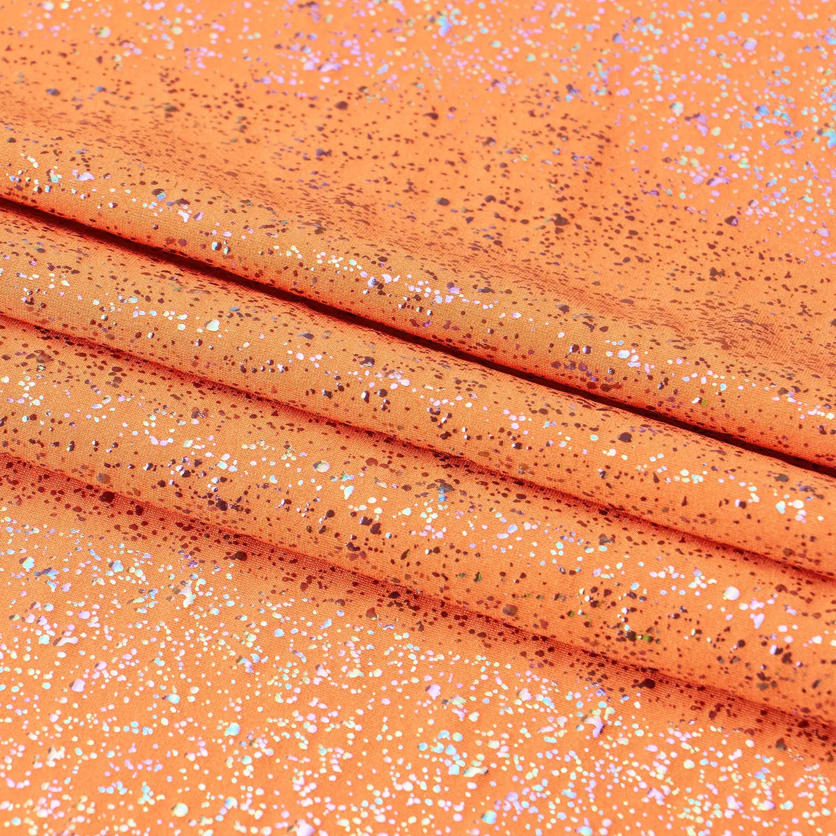 Close-up of orange fabric with glittery specks