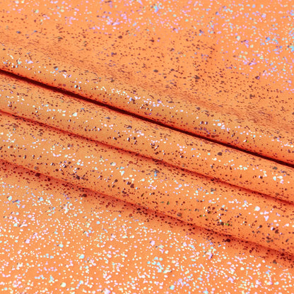 Close-up of orange fabric with glittery specks